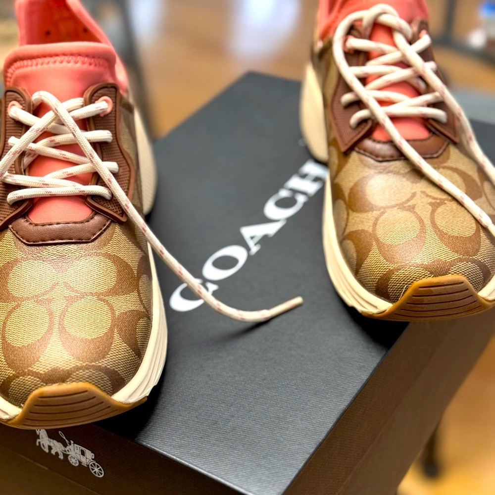 Brand NEW Coach Sneakers in the original box. Never worn.